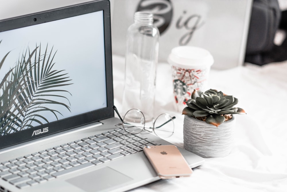 Professional personal computer repair and home IT support technician helping individual with laptop troubleshooting and device setup